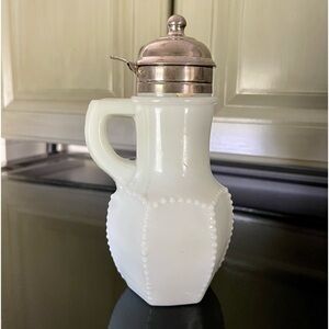 VINTAGE, BEADED, MILK GLASS SYRUP DISPENSER. METAL HINGED LID. 3 1/4”W X 6 3/4”H